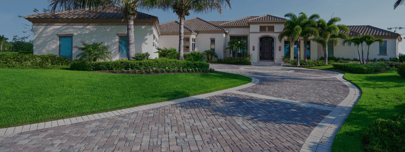 Well-maintained residential lawn and landscaping in Lake City, FL by Blossomwood Lawn Care.